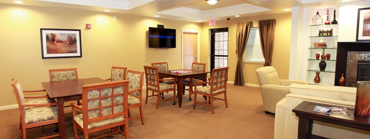 Resident Clubhouse, carpet, large seating area, fireplace